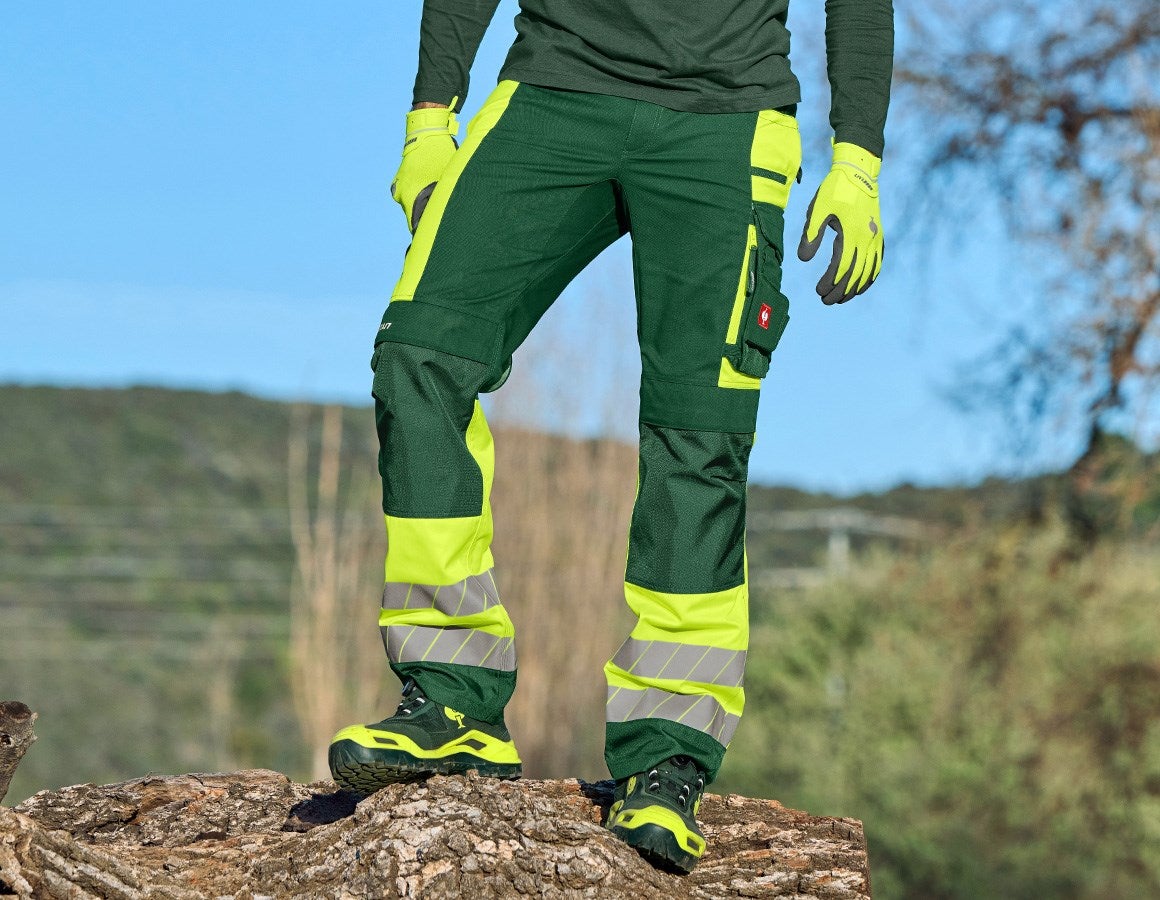Main action image High-vis trousers e.s.motion 24/7 green/high-vis yellow