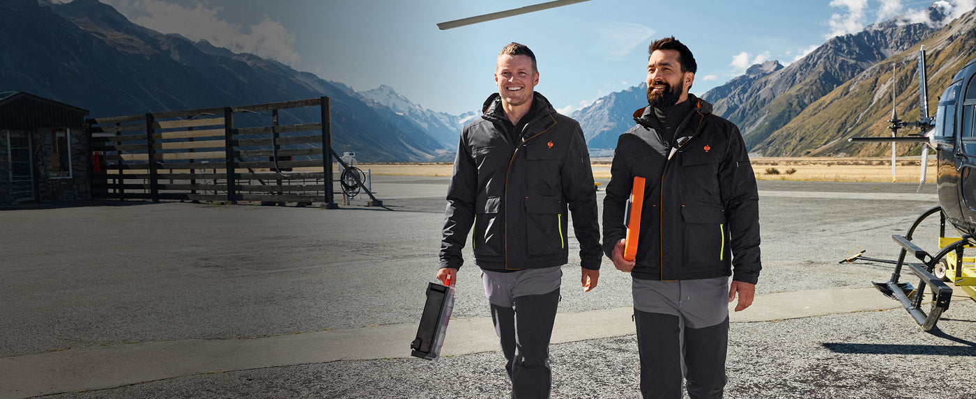 Two men wearing winter jackets from the e.s.trail collection
