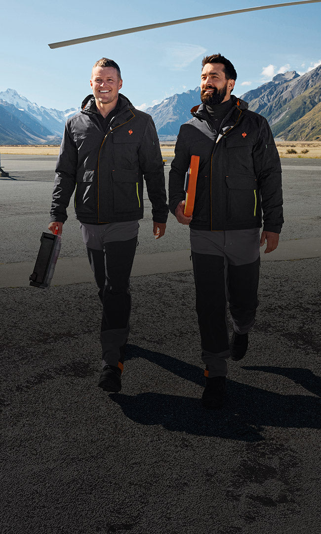 Two men wearing winter jackets from the e.s.trail collection