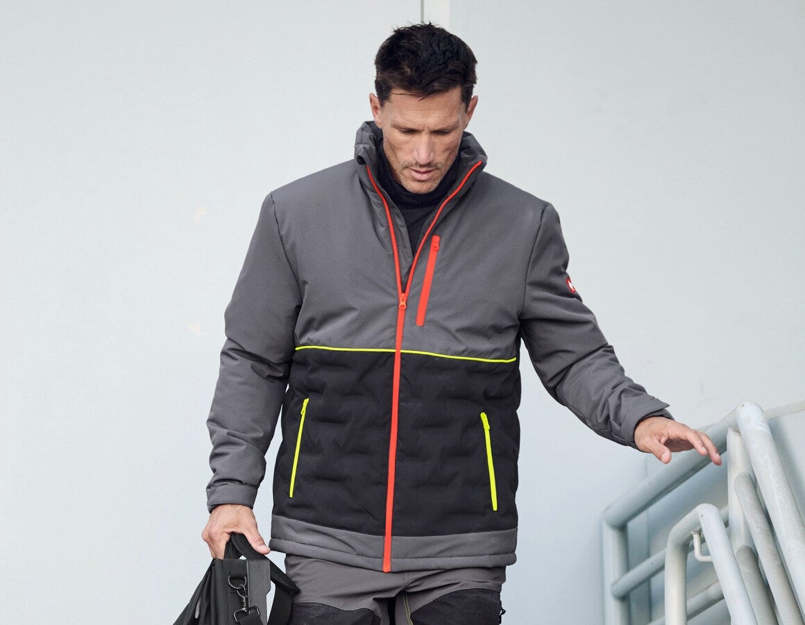 Main action image e.s. Padded jacket anthracite/black/high-vis orange/high-vis yellow